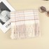 Wholesale of 2024 new Japanese retro checkered tassel scarves for women's winter warmth and versatile student couple scarves